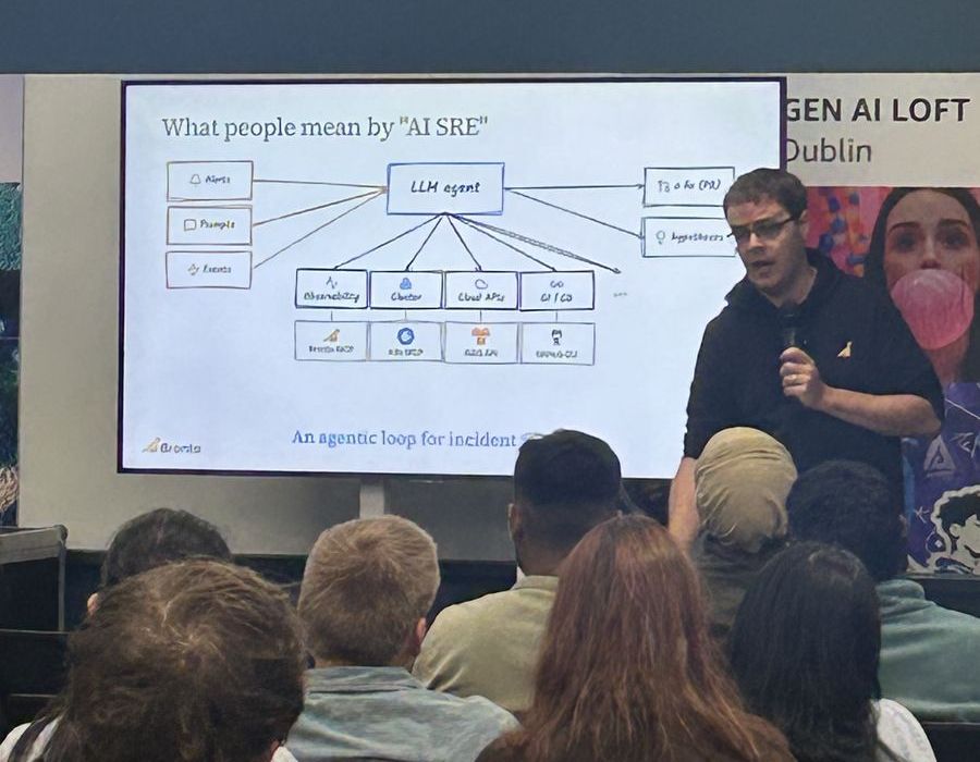The Bronto talk on AI for site reliability, with the audience watching a diagram of an LLM agent